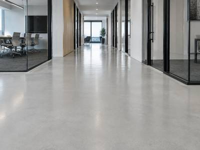 Seamless light coloured floor down an interior corridor in a Halifax facility