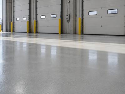 Coated warehouse floor running up to a row of loading dock doors in Halifax
