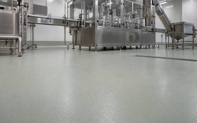 Urethane cement flooring beneath a stainless steel packaging line in a Halifax area food plant